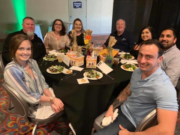Group photo at a table 2018 Celebrity Waiter Dinner