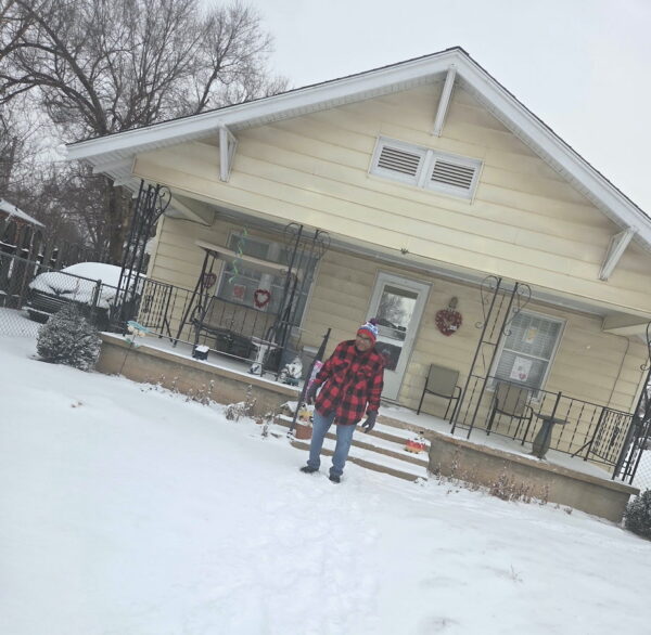 Evergreen Life Services - Winter Storm 2026. Photo of Darrell, an individual served be ELS, in front of his Oklahoma home.