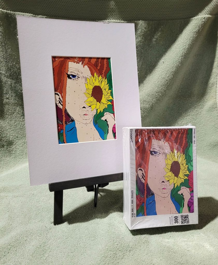Artwork shown in a matte and a smaller version on a box cover