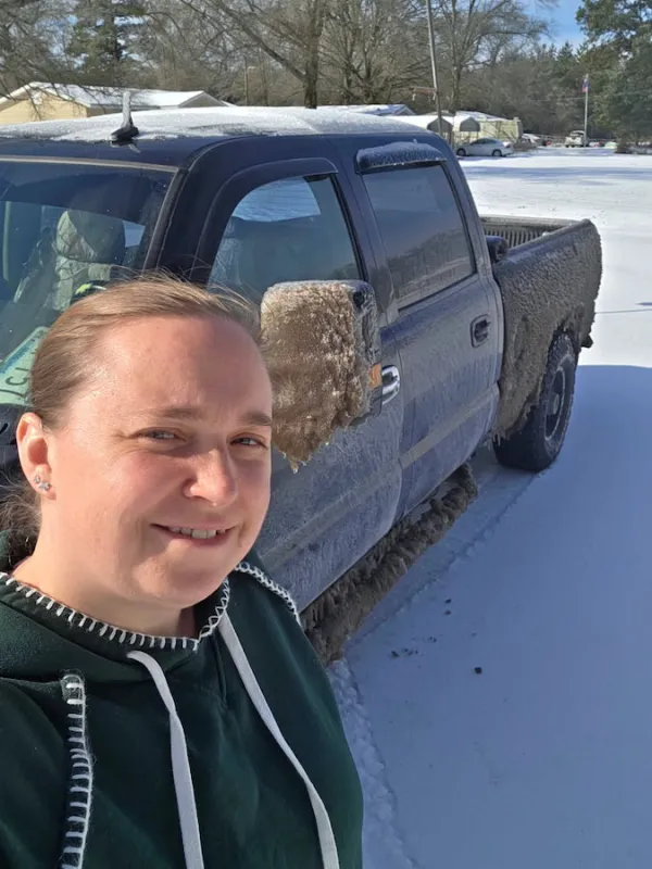 Evergreen Life Services - Winter Storm 2026. Photo of Rose and her truck, Trusty Rusty, in the recent snowstorm.